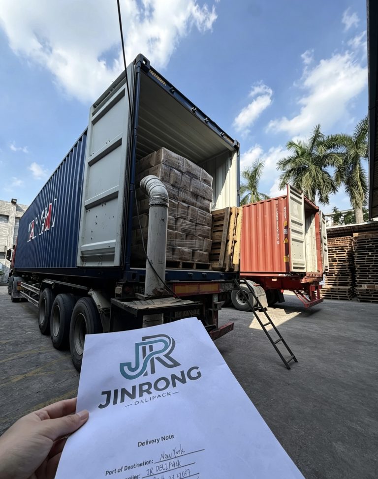 Naturally branded shipment cartons shown during loading