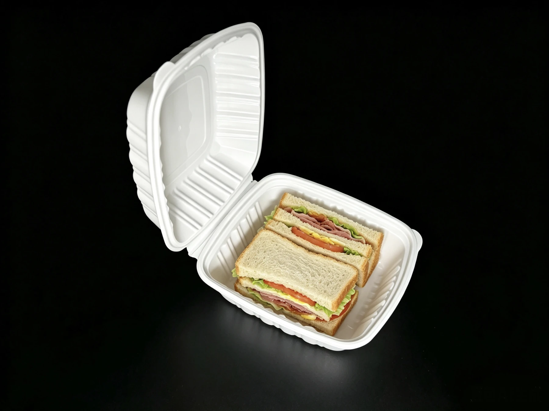 Diagonal view of a PH60 white food container with sandwiches