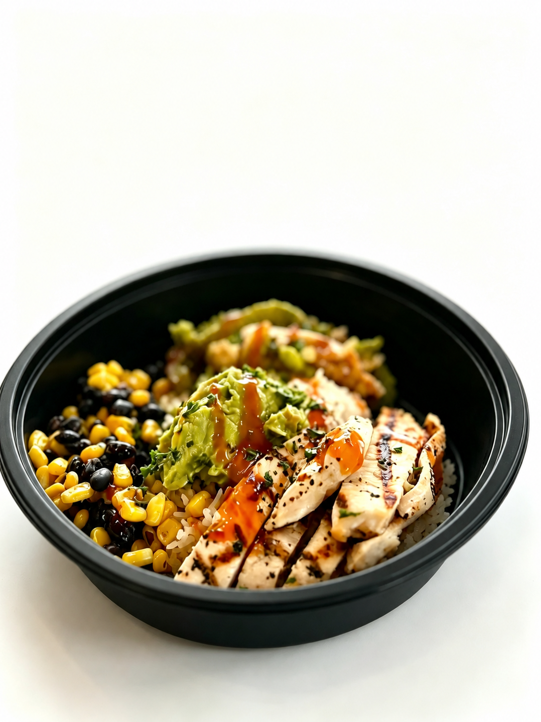 Illustrative black bowl with prepared food